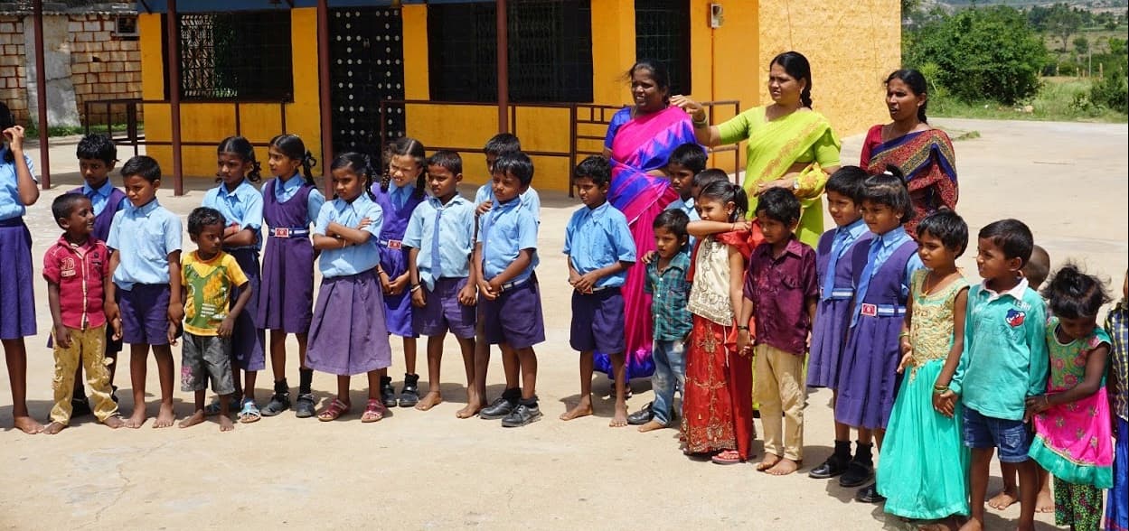 Students seated together during an AIMCORP classroom visit